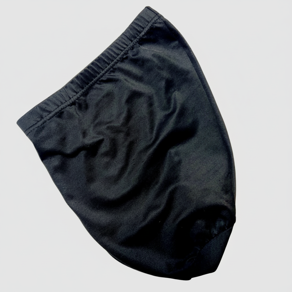 A black slip-resistant hair bonnet with a snug fit, designed to stay in place during sleep.